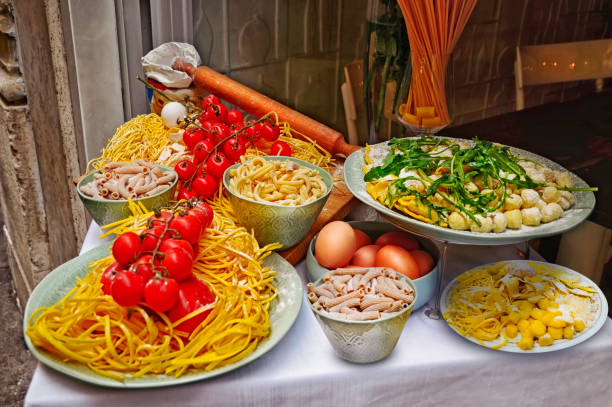 A summer  dinner .Pasta  and homePasta  and homemade food arrangement outside a restaurant in Romemade food arrangement outside a restaurant in Rome  .Tasty and authentic Italian food ,Italy stock photo