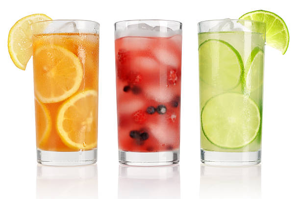 Summer drinks with ice Summer drinks with ice, fresh berries, lemon and lime isolated on white lemon fruit photos stock pictures, royalty-free photos & images