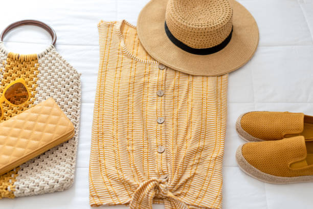 Summer fashion, outfit laid out on the bed Women's summer clothes laid out on the bed - summer style womenswear stock pictures, royalty-free photos & images