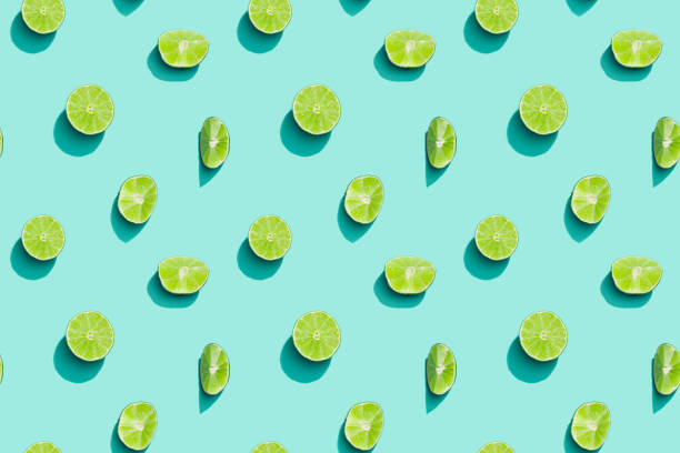 Summer fruits top view, bright juice citrus green lime on blue background. Healthy fruit food. Summer fruits top view, bright juice citrus green lime on blue background. Healthy fruit food. lime stock pictures, royalty-free photos & images