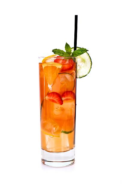 A summer mojito cocktail of strawberries orange and mint  Traditional Einglish Summer Cocktail Pimms highball glass stock pictures, royalty-free photos & images