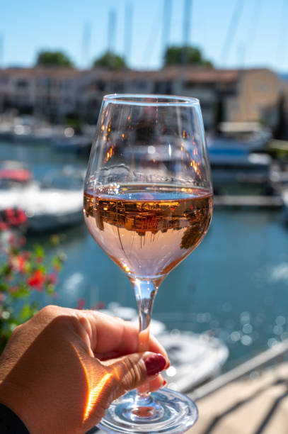 Summer on French Riviera Cote d'Azur, drinking cold rose wine from Cotes de Provence on outdoor terrase in Port Grimaud, Var, France stock photo