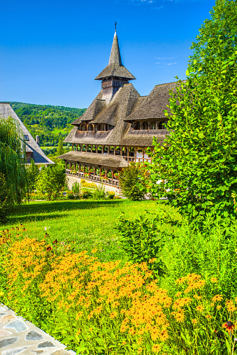 Wide view of Barsana Christian monastery house and garden in Maramures, Romania