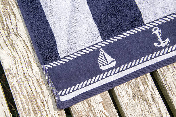 Summer towel with the white and blue ship pattern stock photo