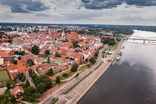 Summer view of Torun old town and Jozef Pilsudski bridge. Architecture in Poland, Europe.