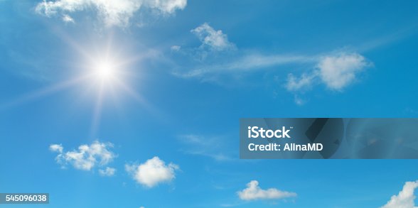 istock sun on blue sky with clouds 545096038