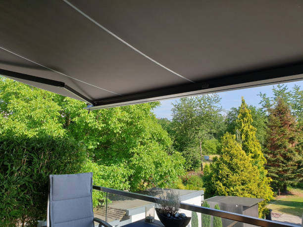 sun protection awning on the terrace - zonnescherm stockfoto's en -beelden