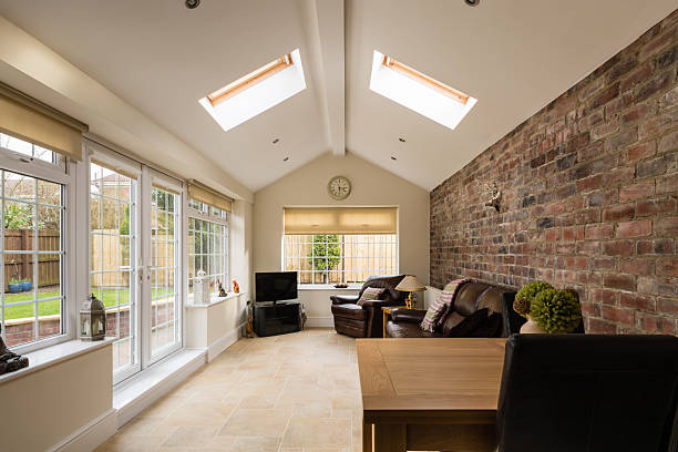 Sun Room Modern Sunroom or conservatory extending into the garden with a featured brick wall ceiling photos stock pictures, royalty-free photos & images