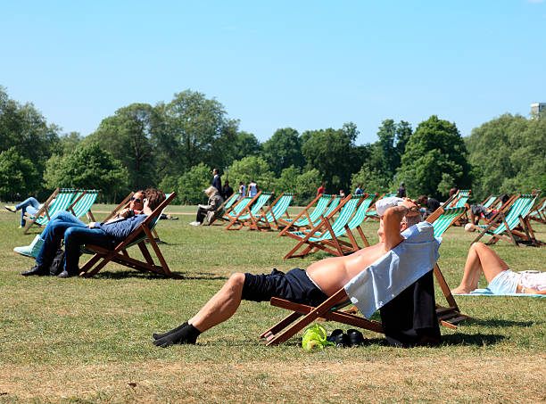 Sunbathers in London's Hyde Park stock photo