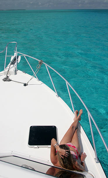 Sunbathing on a yacht stock photo