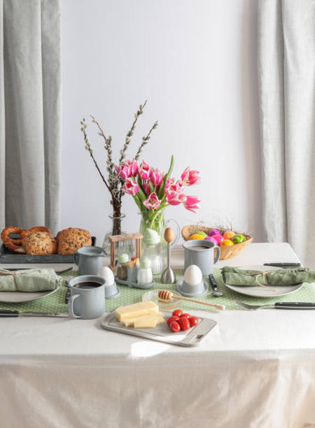 Sunday breakfast table setting with eggs, coffee, butter and bread in Germany Sunday breakfast table setting with eggs, coffee, butter and bread in Germany easter sunday stock pictures, royalty-free photos & images