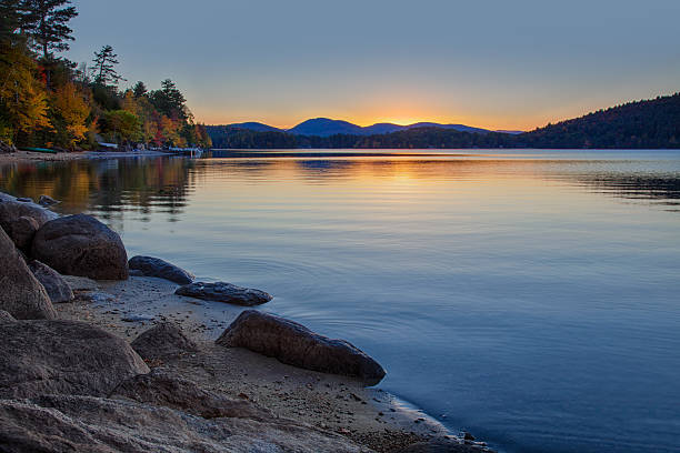 Sundown at Schroon Lake A warm glow shortly after sunset creates a peaceful scene at Schroon Lake in the Adirondacks of New York State. More: adirondack state park stock pictures, royalty-free photos & images