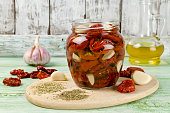 Sun-dried tomatoes with olive oil in a jar. Step by step cooking