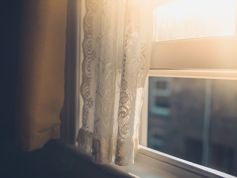 Sunlight Hitting Curtain By Window Stock Photo - Download Image Now