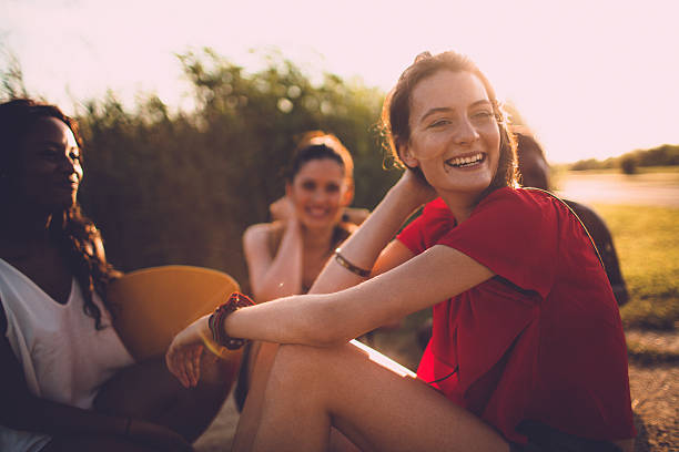 Sunny days are for friends and fun Girlfriends enjoying together in a sunny day young adults hanging out stock pictures, royalty-free photos & images