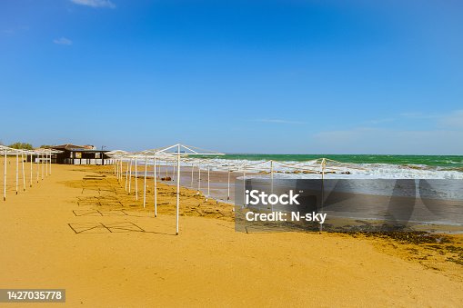 istock Sunny sandy beach in Feodosia Bay in Black sea. Empty beach in autumn season. 1427035778