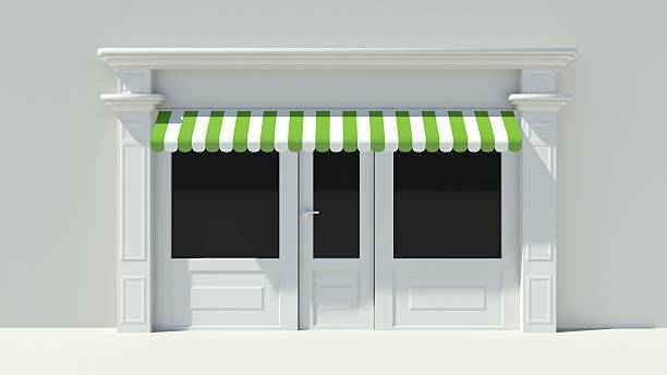 Sunny Shopfront with large windows White store facade Sunny Shopfront with large windows White store facade with green and white awnings awning window stock pictures, royalty-free photos & images