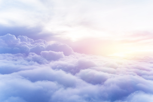 Sunny sky abstract background, beautiful cloudscape, on the heaven, view over white fluffy clouds, freedom concept
