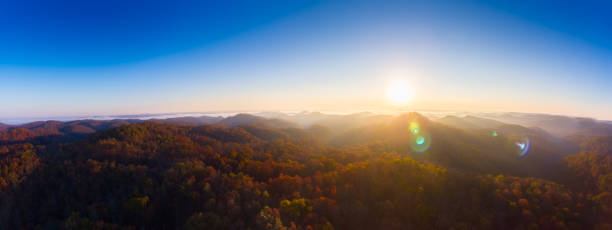 Sunrise at Tater Knob Sun rises over the wilderness of Appalachian mountains near the Tater Knob tire tower in the Daniel Boone National Forest.  Though unused for decades, the fire tower is still accessible to hikers and travelers who go off the beaten path. fire lookout tower stock pictures, royalty-free photos & images