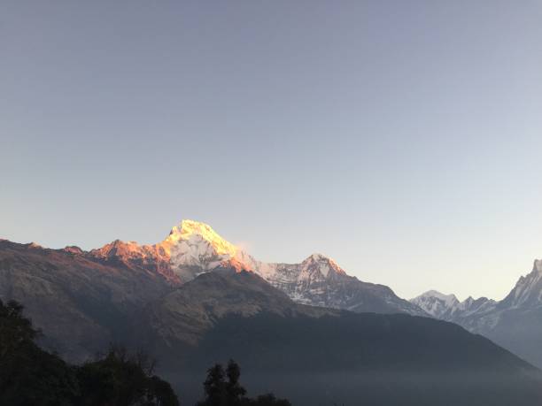 Sunrise colors the Annapurna Mountains stock photo
