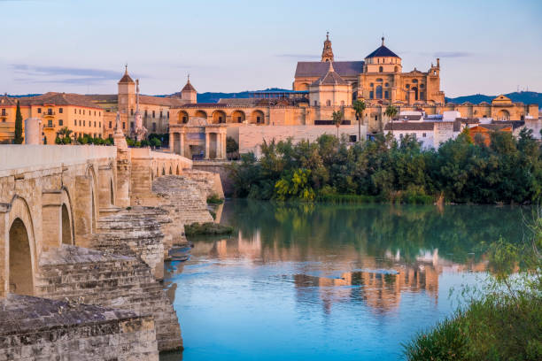 Sunrise in Cordoba Early morning view of the Cordoba mosque and Roman bridge cordoba mosque stock pictures, royalty-free photos & images