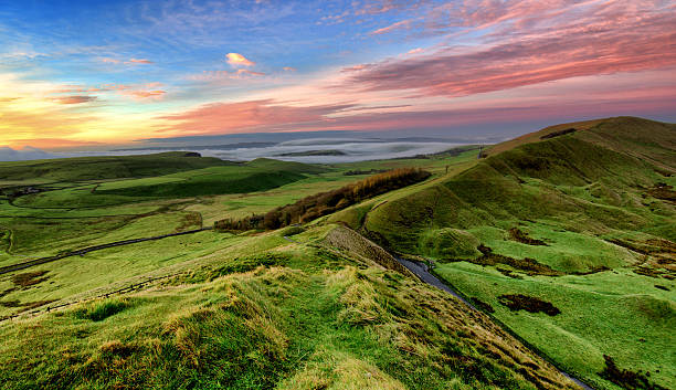 Sunrise on Mam Tor Sunrise on Mam Tor, The Peak District National Park  derbyshire stock pictures, royalty-free photos & images