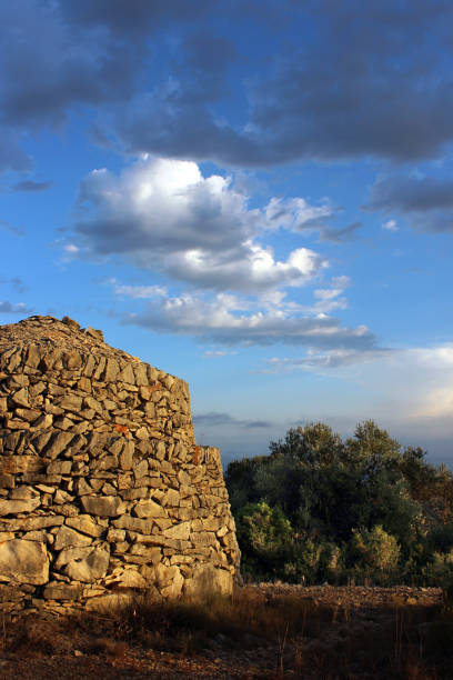 Sunrise on the dry stone construction, Barraca de Quicolis at la Serreta de Freginals in Montsia, Catalonia, Spain stock photo