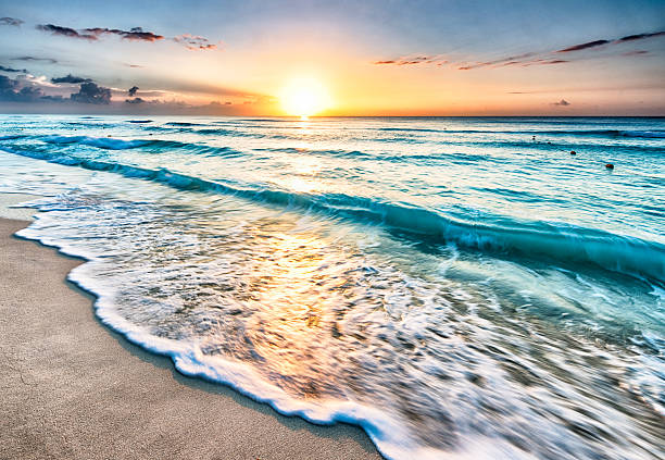Sunrise over beach in Cancun Beautiful sunrise over beach in Cancun cancun stock pictures, royalty-free photos & images
