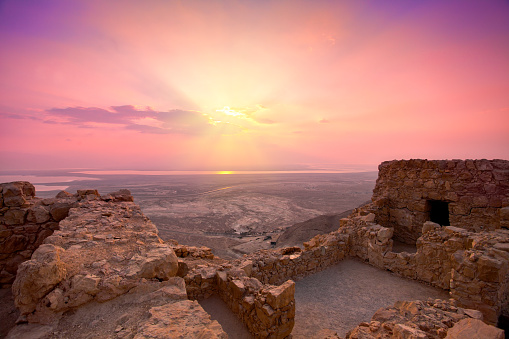 Beautiful sunrise over Masada fortress in Judaean Desert, Israel