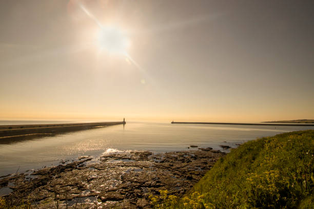 Sunrise over the entrance to Tynemouth Harbour in Tyne and Wear, UK stock photo