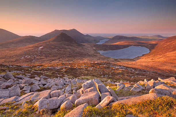 Sunrise over the Mourne Mountains and lakes in Northern Ireland stock photo