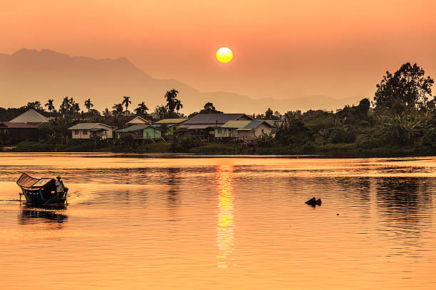 Sunset along river in Kuching, Borneo stock photo
