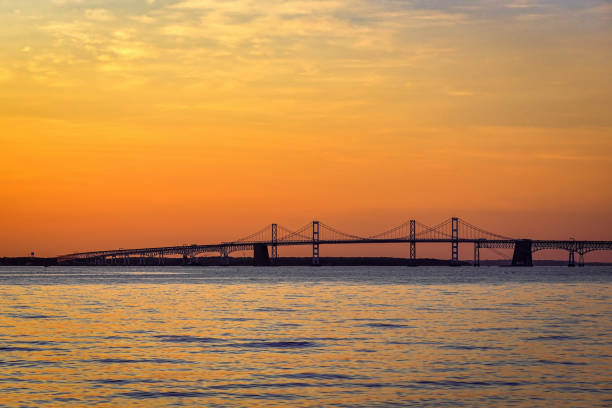 Sunset and dramatic sky at Chesapeake Bay Bridge stock photo