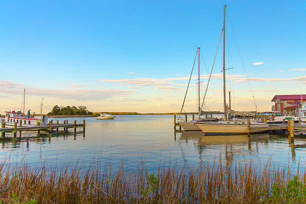 Sunset at Chesapeake Martime Museum in St Michaels Maryland St Michaels Harbor at Sunset bay of water photos stock pictures, royalty-free photos & images