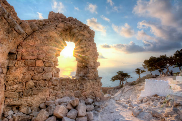 tramonto al castello di monolithos, isola di rodi, grecia - rodi foto e immagini stock