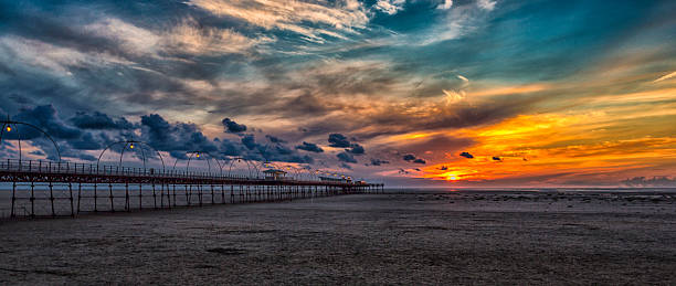 Sunset at Southport The sun setting at Southport merseyside stock pictures, royalty-free photos & images