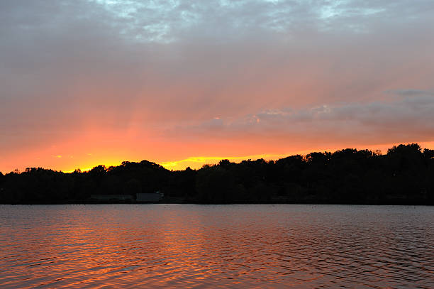 Sunset cross the lake stock photo