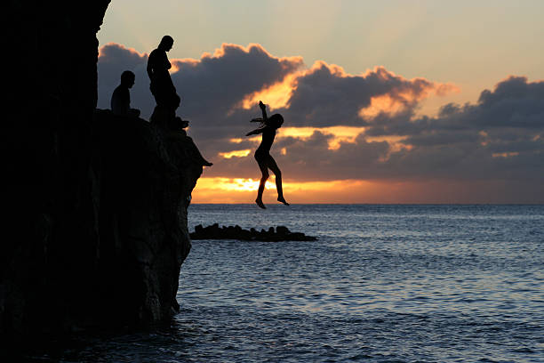 Sunset Freefall  cliff jumping stock pictures, royalty-free photos & images
