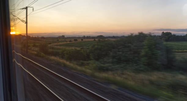 Sunset from a speeding train, blurred motion, Transportation and travel, vacations stock photo