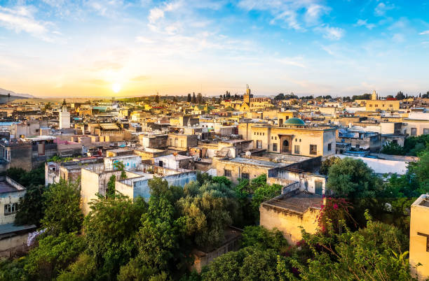 Sunset in Fes Panorama of Old Medina in Fes city, Morocco fez morocco stock pictures, royalty-free photos & images