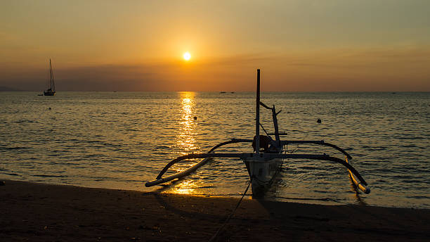 Sunset in Lovina Bali stock photo