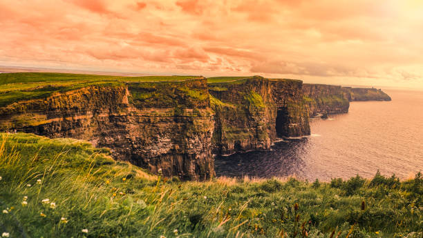 Sunset in Moher of Cliff, ireland Full frame shot Moher of Cliff in Clare , Ireland cliffs of moher stock pictures, royalty-free photos & images
