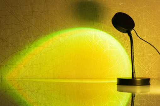 Sunset projector lamp close up. Multi colored RGB light. Home decor. Selective focus