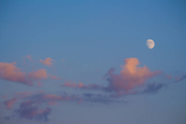 sunset moon with clouds - planet zoom out imagens e fotografias de stock