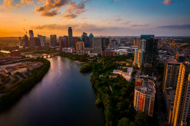 Sunset of a lifetime in the greatest city in America - Austin , Texas Austin Texas USA Aerial Drone view over lady bird lake at Golden Hour sunset with amazing view of Skyline Cityscape of downtown urban capital city at sunset with amazing clouds and color riverbank stock pictures, royalty-free photos & images