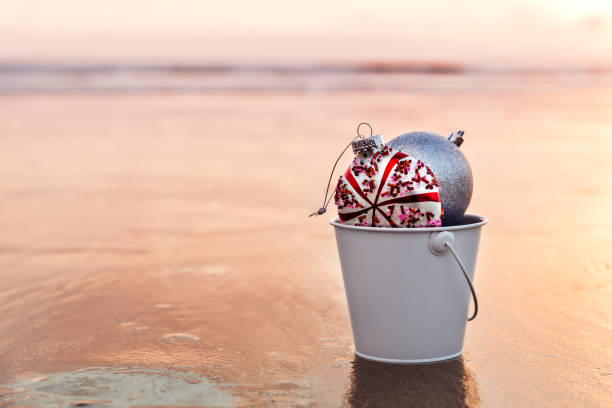 Sunset on the beach and Christmas decorations stock photo