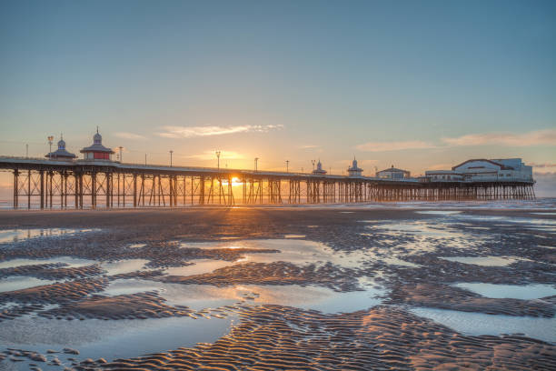 Sunset on the Beach. Blackpool Beach at Sunset with the Historic  Victorian North Pier. north pier stock pictures, royalty-free photos & images