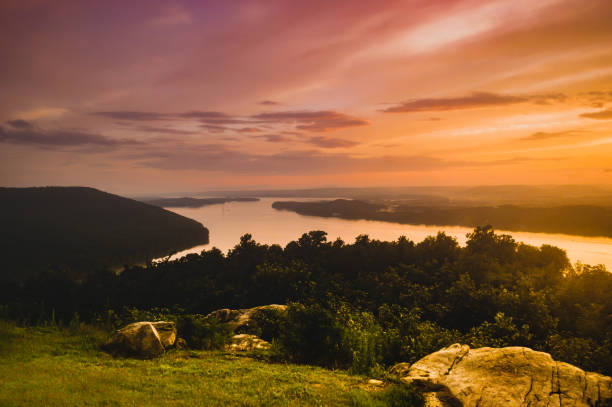 Sunset on the Tennessee River Images of an epic sunset over Tennessee River after a storm. tennessee river stock pictures, royalty-free photos & images