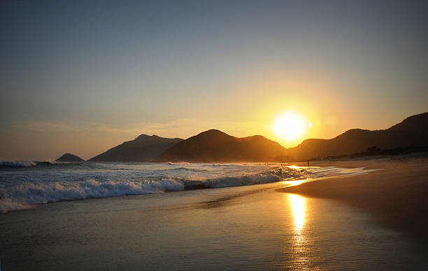 Sunset on  travel destination beach in exotic Brazil stock photo