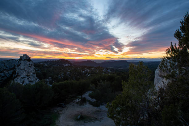 Sunset or Sunrise over the Alpilles sky with orange and yellow colors. With beautiful clouds, perfect for sky replacement. stock photo